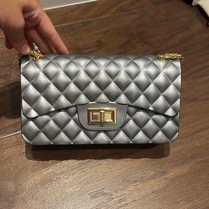 A grey top shop plastic bag